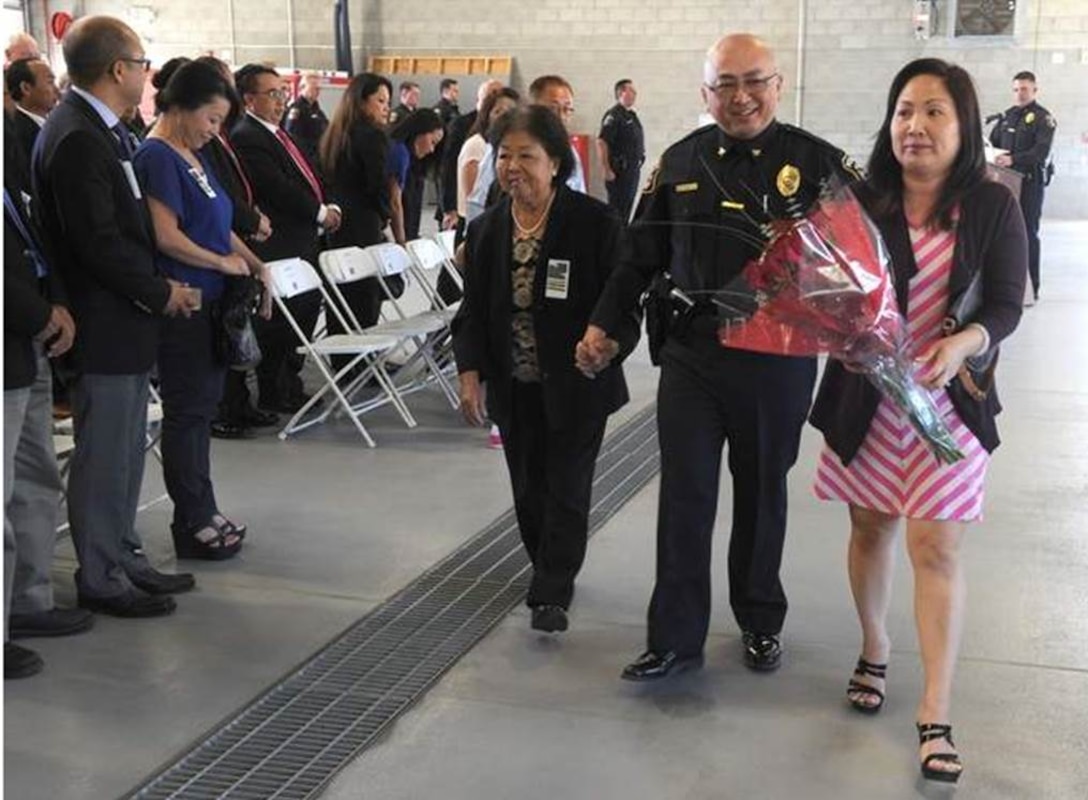 Chuepheng Lo with his mother, Khou Lo, left and wife, Helen Lo, during a promotion ceremony to chief of police for the Defense Logistics Agency San Joaquin Police Department in Tracy. 