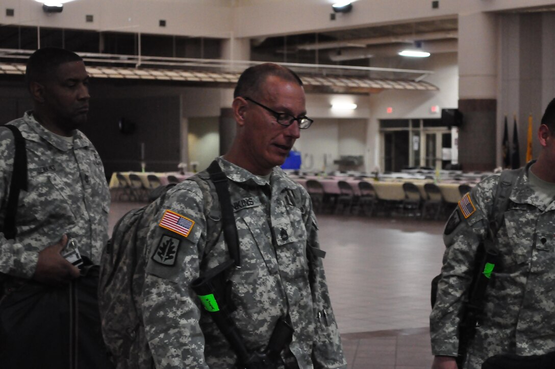 Sgt. 1st Class Richard Jenkins, platoon sergeant, 2nd platoon sergeant, 307th Military Police Company, scans in with the personnel section for accountability at the Silas L. Copeland Arrival/Departure Airfield Control Group, March 27, before departing on a mission in Guantanamo Naval Base, Cuba