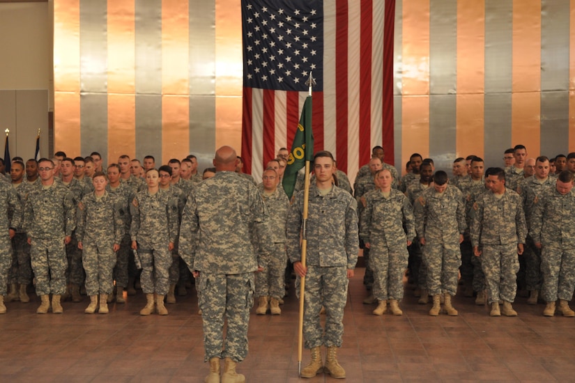 Soldiers with the 307th Military Police Company get into formation at the Silas L. Copeland Arrival/Departure Airfield Control Group March 27 prior to the company’s departure to Guantanamo Naval base, Cuba.