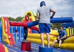 Members of Joint Base San Antonio-Randolph joust during Famaganza at the Youth Programs Complex on JBSA-Randolph April 9, 2016. Famaganza, a free family event open to all Department of Defense cardholders, featured entertainment, food and information booths.
