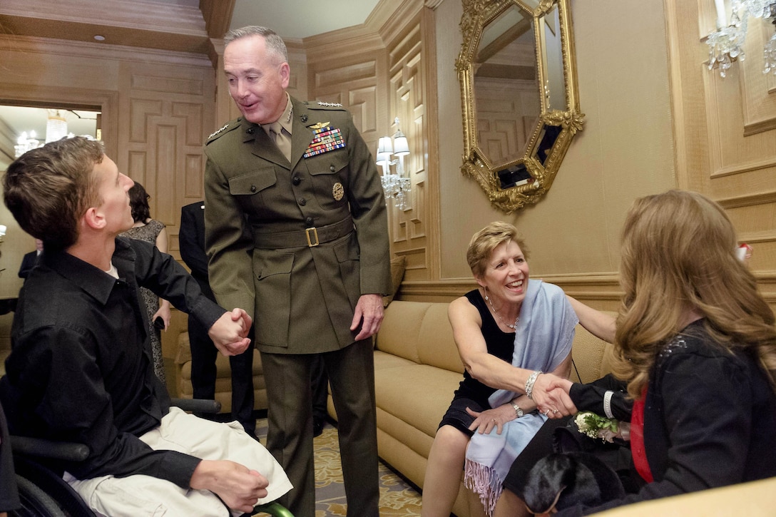 Marine Corps Gen. Joe Dunford, chairman of the Joint Chiefs of Staff, and his wife, Ellyn, meet with military families attending the Military Child of the Year Awards Gala in Arlington, Va., April 14, 2016. Dunford was the keynote speaker during the annual event.  DoD photo by Army Staff Sgt. Sean K. Harp