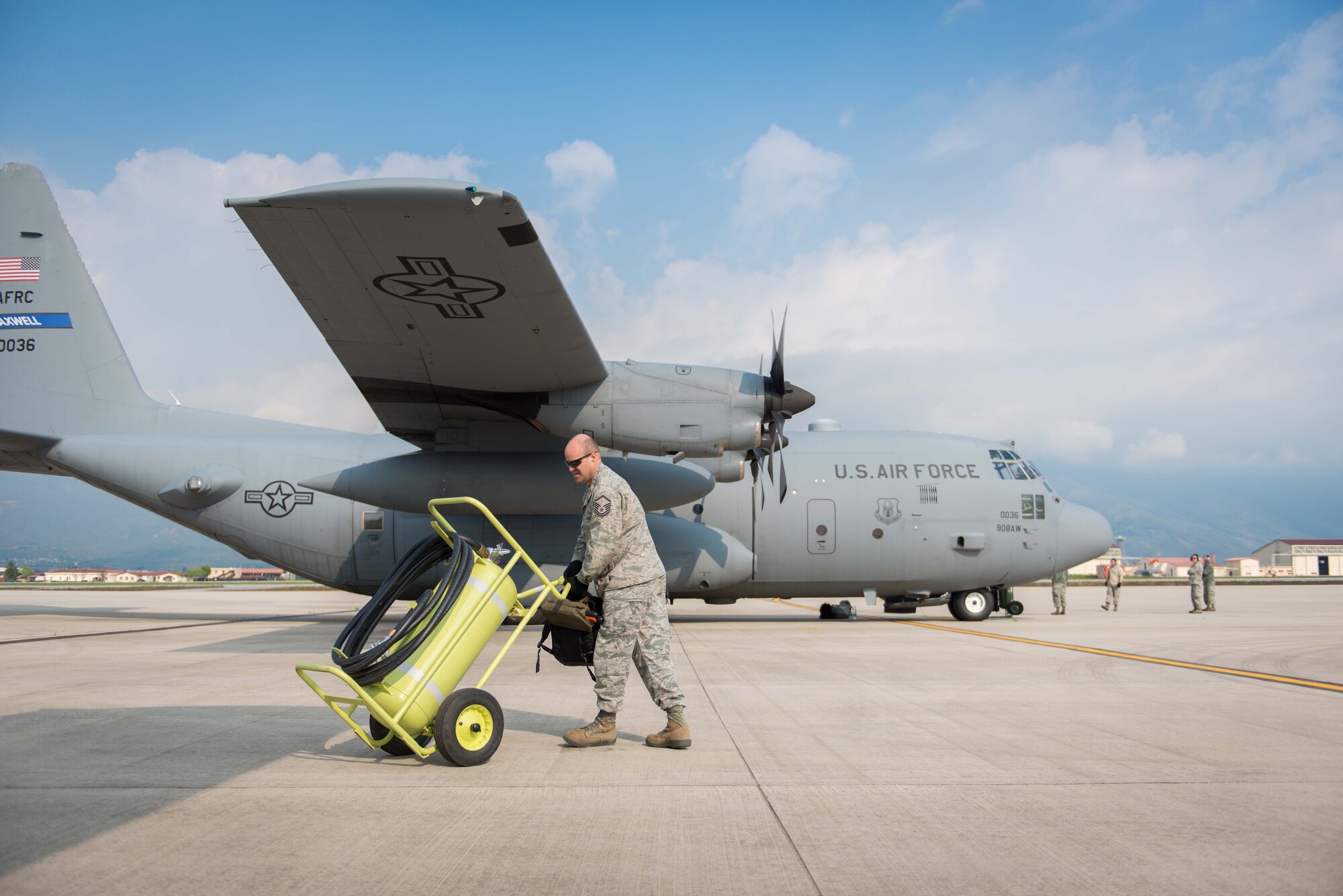 Master Sgt. Ian Owen, a crew chief from the Aircraft Maintenance Squadron, prepares the fire cart for a C-130 in preparation of a flight from Aviano AB, Italy, on 11 April, as a part of Exercise Saber Junction. (U.S. Air Force photo by Staff Sgt. Trevor Saylor)