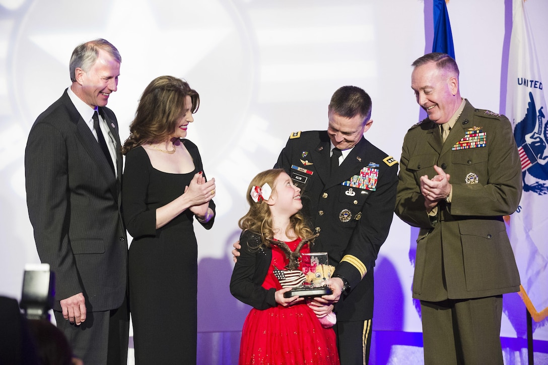 Lorelei McIntyre-Brewer, 10, receives a Military Child of the Year Award during a gala in Arlington, Va., April 14, 2016. DoD photo by Army Staff Sgt. Sean K. Harp