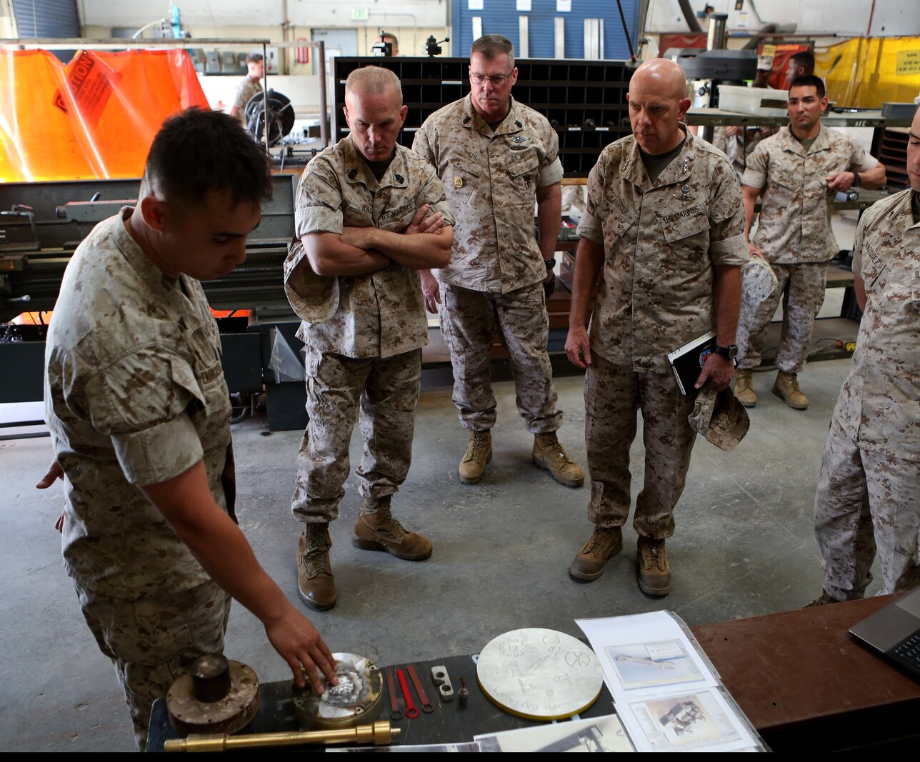 U.S. Marine Lt. Gen. David A. Berger and other high-level unit leaders receive a capabilities demonstration on 3-D printing technology aboard Camp Pendleton, Calif., April 6, 2016. Berger is the commanding general of I Marine Expeditionary Force. Marines with 1st Maintenance Battalion, Combat Logistics Regiment 15, 1st Marine Logistics Group, demonstrated the potential of 3-D printing capabilities to the commanders of I MEF and 1st MLG. Still in the testing phase, the battalion has already discovered endless possibilities as to how they can integrate the technology into their mission. (U.S. Marine Corps photo by Cpl. Carson Gramley/released)