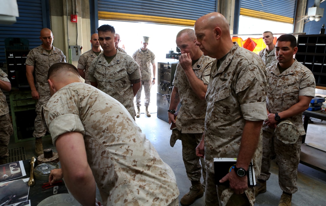 U.S. Marine Lt. Gen. David A. Berger and other high-level unit leaders receive a capabilities demonstration on 3-D printing technology aboard Camp Pendleton, Calif., April 6, 2016. Berger is the commanding general of I Marine Expeditionary Force. Marines with 1st Maintenance Battalion, Combat Logistics Regiment 15, 1st Marine Logistics Group, demonstrated the potential of 3-D printing capabilities to the commanders of I MEF and 1st MLG. Still in the testing phase, the battalion has already discovered endless possibilities as to how they can integrate the technology into their mission. (U.S. Marine Corps photo by Cpl. Carson Gramley/released)