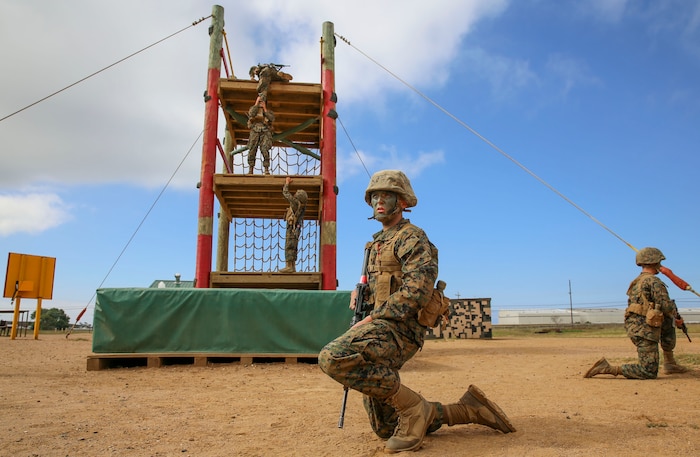 Private Joseph A. Pratt, Alpha Company, 1st Recruit Training Battalion, waits for his turn to climb an obstacle during the Crucible at Marine Corps Base Camp Pendleton, Calif., April 12. Following recruit training, Pratt will report to the School of Infantry at Marine Corps Base Camp Pendleton, Calif., and then to his military occupational specialty school to become a motor transportation operator. Annually, more than 17,000 males recruited from the Western Recruiting Region are trained at MCRD San Diego. Alpha Company is scheduled to graduate April 22.