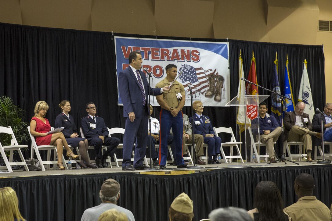 Cpl. Stephen Garces, noncommissioned officer in charge of drafting and surveying, Marine Wing Support Squadron 374, is recognized during the 6th Annual Veteran’s Expo at the Riverside County Fairgrounds in Indio, Calif., April 2, 2016. (Official Marine Corps photo by Lance Cpl. Levi Schultz/Released)