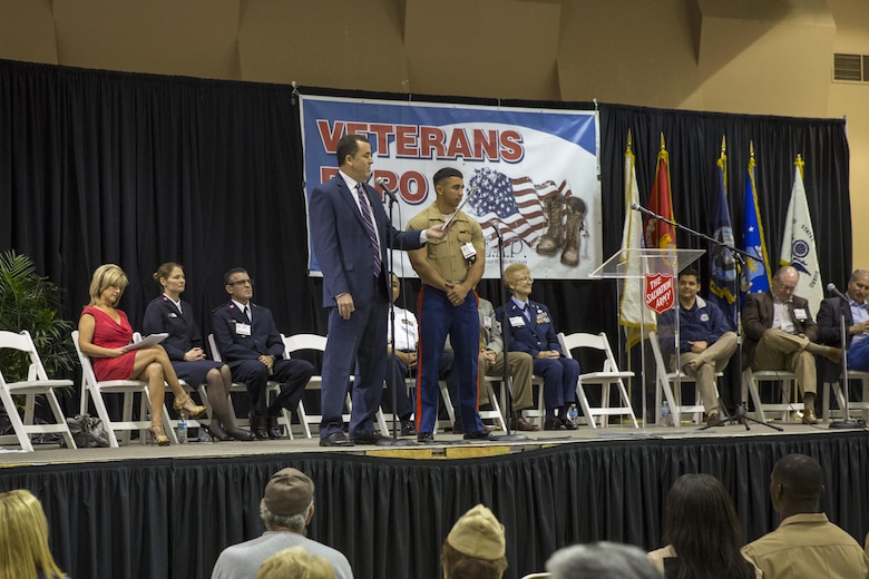 Cpl. Stephen Garces, noncommissioned officer in charge of drafting and surveying, Marine Wing Support Squadron 374, is recognized during the 6th Annual Veteran’s Expo at the Riverside County Fairgrounds in Indio, Calif., April 2, 2016. (Official Marine Corps photo by Lance Cpl. Levi Schultz/Released)