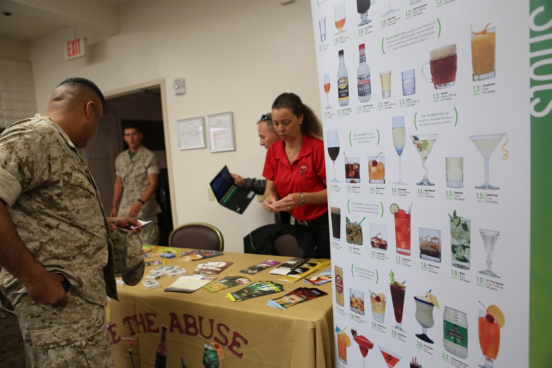 Marines with 1st Marine Logistics Group visit a substance abuse resource booth during the 101 days of summer campaign kick-off event aboard Camp Pendleton, Calif., April 11, 2016.  Leaders within 1st MLG stressed the importance of taking care of their own and taking the time to know their Marines. Various organizations directed at supporting and enriching service members’ lives had pamphlets and helpful information readily available for all who attended. (U.S. Marine Corps photo by Sgt. Laura Gauna/released)