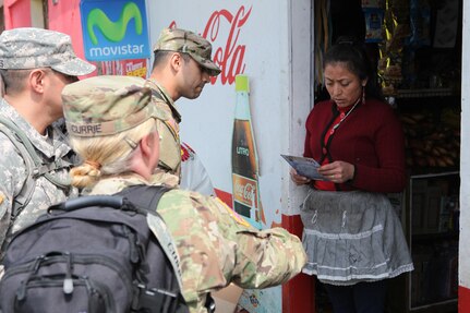 U.S. Army members walk the streets to pass out flyers and educate the local population about a free medical clinic that will be provided by the U.S. military at Palo Gardo, Guatemala, March 29, 2016. Task Force Red Wolf and Army South conducts Humanitarian Civil Assistance Training to include tactical level construction projects and Medical Readiness Training Exercises providing medical access and building schools in Guatemala with the Guatemalan Government and non-government agencies from 05MAR16 to 18JUN16 in order to improve the mission readiness of US Forces and to provide a lasting benefit to the people of Guatemala. (U.S. Army photo by Sgt.Prosper Ndow/Released)