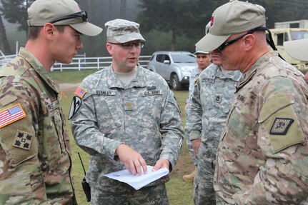 U.S. Army Lt. Col. Darrell Martin with Task Force (TF) Red Wolf gets a briefing at the construction site for the Aldea Polopon clinic at Palo Gordo, Guatemala, March 29, 2016. TF Red Wolf and Army South conducts Humanitarian Civil Assistance Training to include tactical level construction projects and Medical Readiness Training Exercises providing medical access and building schools in Guatemala with the Guatemalan Government and non-government agencies from 05MAR16 to 18JUN16 in order to improve the mission readiness of US Forces and to provide a lasting benefit to the people of Guatemala. (U.S. Army photo by Sgt. Prosper Ndow/Released)