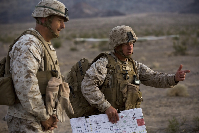 Colonel William Vivian, commanding officer, 7th Marine Regiment, escorts Maj. Gen. Daniel O’Donohue, Commanding General, 1st Marine Division, to the Combat Operations Center in the Lead Mountain training area during the regiment’s Combined Arms Live Fire Exercise aboard the Combat Center April 5, 2016. CALFEX served as the kinetic portion of Desert Scimitar 16, an annual 1st Marine Division training evolution. (Official Marine Corps photo by Cpl. Julio McGraw/ Released)