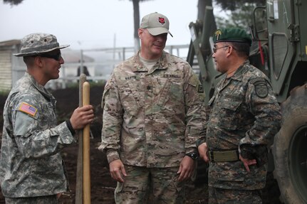 U.S. Army Lt. Col. Darrell Martin with Task Force (TF) Red Wolf talks to Coronel de Infanteria DEM. Carlos Guillermo Lopez Guitierrez of the Guatemalan army montana division at Palo Gordo, Guatemala, March 29, 2016. TF Red Wolf and Army South conducts Humanitarian Civil Assistance Training to include tactical level construction projects and Medical Readiness Training Exercises providing medical access and building schools in Guatemala with the Guatemalan Government and non-government agencies from 05MAR16 to 18JUN16 in order to improve the mission readiness of US Forces and to provide a lasting benefit to the people of Guatemala. (U.S. Army photo by Sgt. Prosper Ndow/Released)