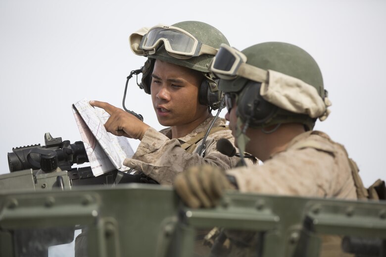 Marines with Company C, 3rd Light Armored Reconnaissance Battalion, plan their route during the offensive portion of 7th Marine Regiment’s Combined Arms Live Fire Exercise aboard the Combat Center April 5, 2016. CALFEX served as the kinetic portion of Desert Scimitar 16, an annual 1st Marine Division training evolution. (Official Marine Corps photo by Cpl. Julio McGraw/ Released)