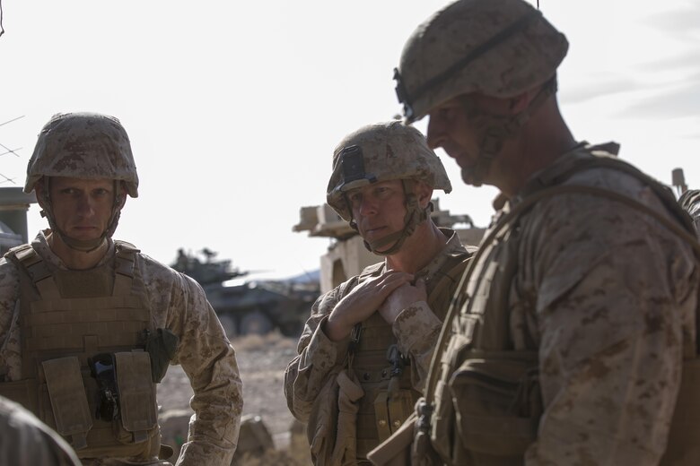 Lt. Col Andrew Nelson, commanding officer, 3rd Battalion, 7th Marine Regiment, Col. William Vivian, commanding officer, 7th Marine Regiment, and Maj. Gen. Daniel O’Donohue, Commanding General, 1st Marine Division, receive a brief on the maneuver of forces during the defense portion of 7th Marine Regiment’s Combined Arms Live Fire Exercise aboard the Combat Center April 6, 2016. CALFEX served as the kinetic portion of Desert Scimitar 16, an annual 1st Marine Division training evolution. (Official Marine Corps photo by Cpl. Julio McGraw/ Released)