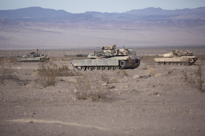 M1A1 Abrams Main Battle Tanks with Company B, 1st Tank Battalion, stage in the Blacktop training area during 7th Marine Regiment’s Combined Arms Live Fire Exercise aboard the Combat Center April 6, 2016. CALFEX served as the kinetic portion of Desert Scimitar 16, an annual 1st Marine Division training evolution. (Official Marine Corps photo by Cpl. Julio McGraw/ Released)