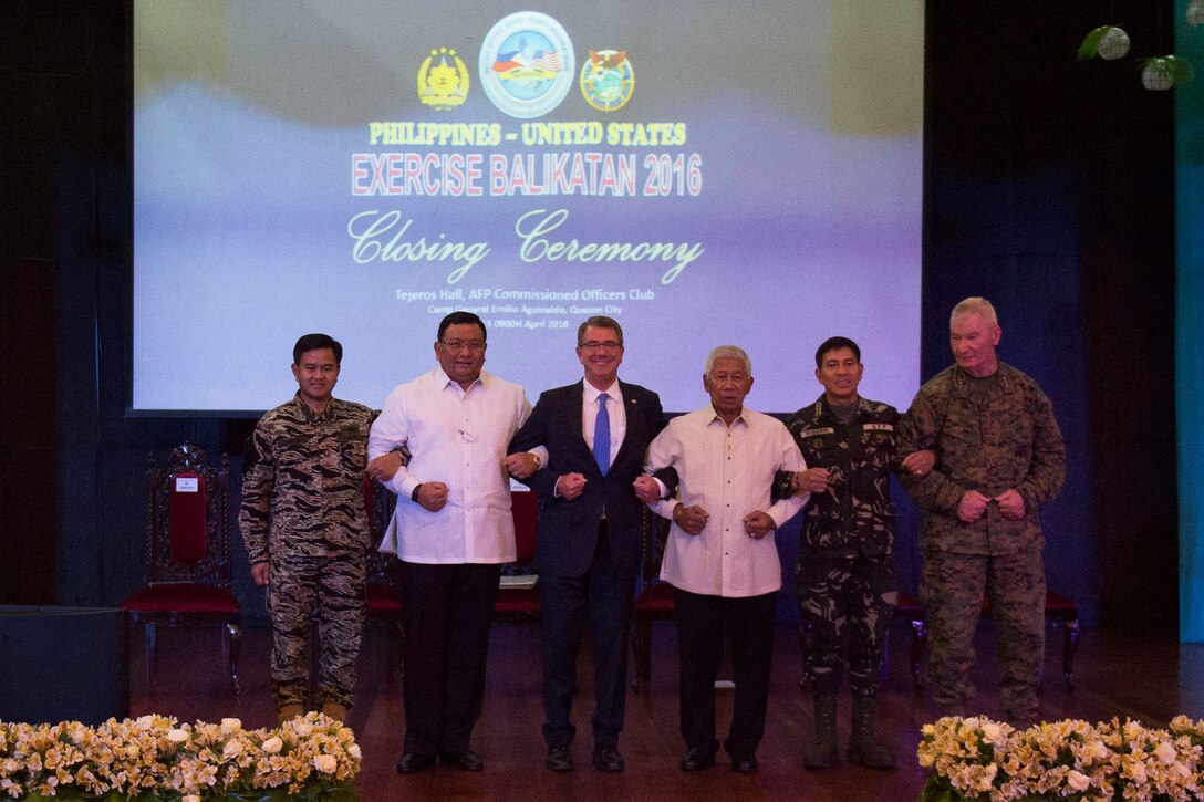 Defense Secretary Ash Carter, center left, Philippine Defense Secretary Voltaire Gazmin, center right, and other leaders pose for a photo during the closing ceremony of Exercise Balikatan 2016 in Manila, Philippines, April 15, 2016. "Balikatan" is a Filipino term that means "shoulder-to-shoulder." DoD photo by Air Force Senior Master Sgt. Adrian Cadiz