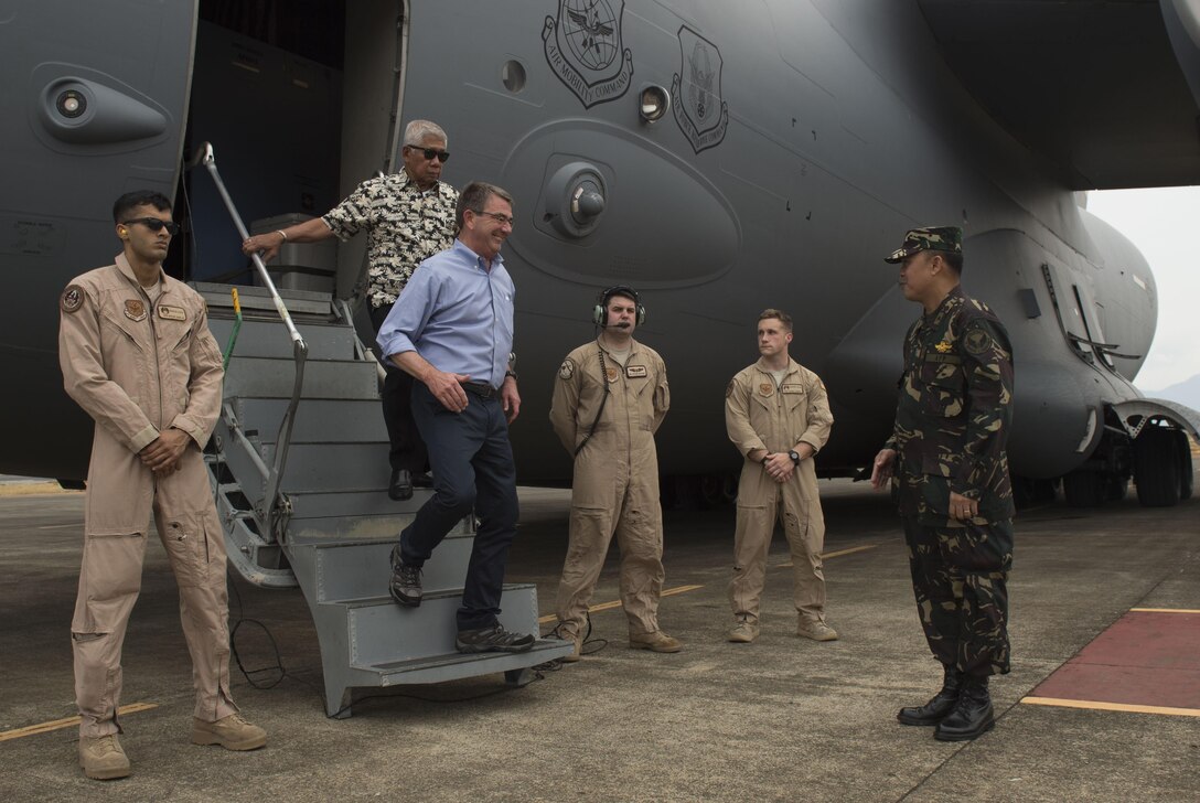 Defense Secretary Ash Carter and Philippine Defense Secretary Voltaire Gazmin arrive at Puerto Princesa airport in Palawan, Philippines, while en route to visit the aircraft carrier USS John C. Stennis in the South China Sea, April 15, 2016. DoD photo by Air Force Senior Master Sgt. Adrian Cadiz