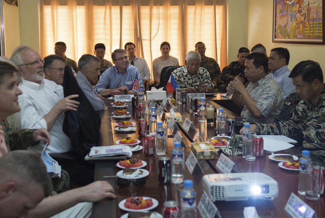 Defense Secretary Ash Carter, center left, and Philippine Defense Secretary Voltaire Gazmin, center right, receive a briefing on the mission of the Philippine armed forces' Western Command after arriving in Palawan, Philippines, April 15, 2016. DoD photo by Air Force Senior Master Sgt. Adrian Cadiz
