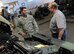 U.S. Air Force Tech. Sgt. Kevin Lamb, the 90th Logistics Readiness Squadron (LRS) NCO in charge of intercontinental ballistic missiles (ICBM), visits with Brian Poese, the 509th LRS vehicle management flight chief, at Whiteman Air Force Base, Mo., April 14, 2016. While members of the 90th Missile Wing were at Whiteman, they visited their 509th Bomb Wing counterparts and observed the way they operate. 