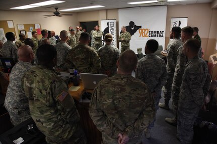 U.S. Army Sgt. Maj. William Armstrong, the Visual Information proponet from the U.S. Army Signal School, pauses while giving a speech to U.S. and partner nation service members at Fort Gordon, Ga., April 12, 2016. Operation Skyfall USA (OS-U) is a 982nd Combat Camera Company (Airborne) Theater Security Cooperation initiative. OS-U is a joint, multi-component, multi-lateral Combat Camera subject matter expert exchange taking place in multiple locations in Georgia. OS-U is part of a series that includes OS-Deutschland, OS-France, and OS-Kosovo. (U.S. Army photo by Spc. Joshua Wooten/Released)