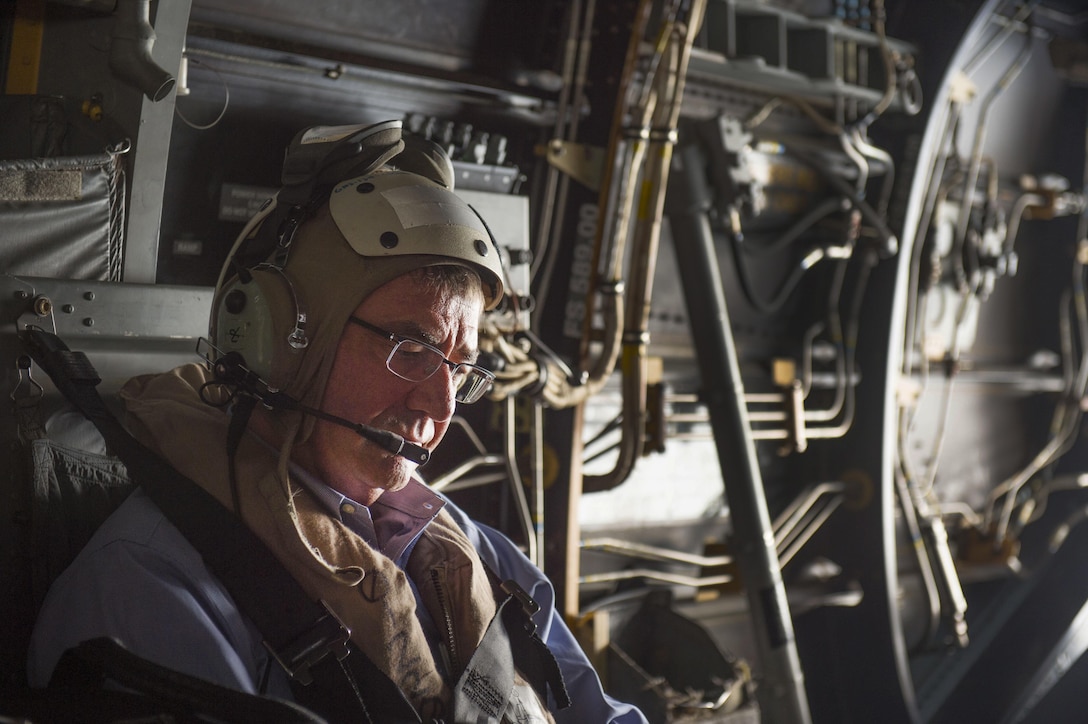 Defense Secretary Ash Carter listens to radio traffic aboard a Marine Corps MV-22 Osprey as he and Philippine Defense Secretary Voltaire Gazmin depart from Palawan, Philippines, to visit the USS John C. Stennis in the South China Sea, April 15, 2016. DoD photo by Air Force Senior Master Sgt. Adrian Cadiz