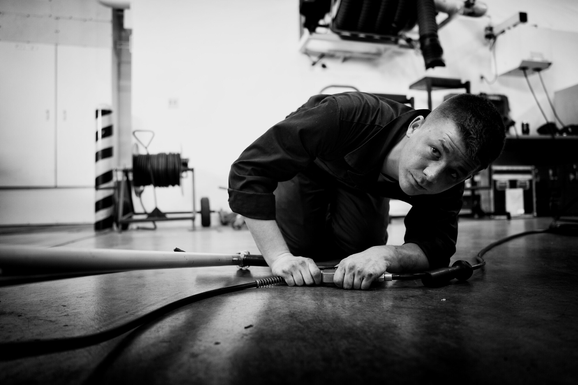 U.S. Air Force Airman 1st Class Justin Stephens, 374th Logistics Readiness Squadron vehicle maintenance apprentice, installs tires onto a government vehicle at Yokota Air Base, Japan, April 13, 2016. The vehicle maintenance shop inspect all Yokota government vehicles to ensure that all assets are serviceable and maintained. (U.S. Air Force photo by Senior Airman Delano Scott/Released)
