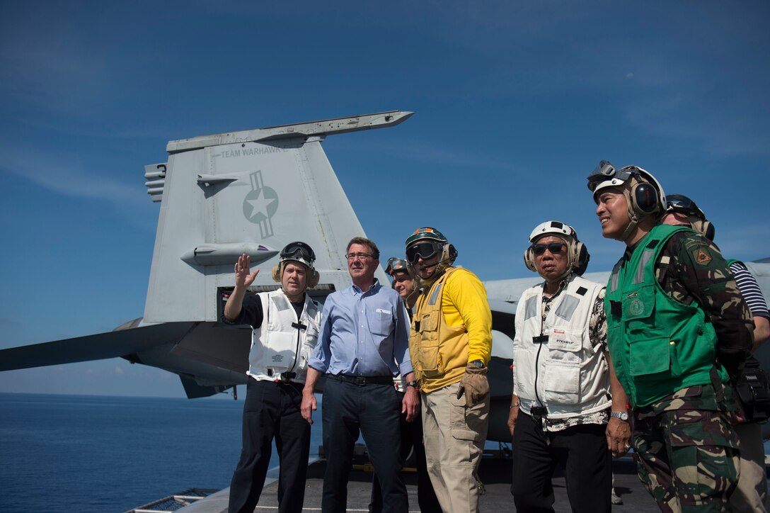 Defense Secretary Ash Carter and Philippine Defense Secretary Voltaire Gazmin tour the flight deck of the USS John C. Stennis in the South China Sea, April 15, 2016. DoD photo by Air Force Senior Master Sgt. Adrian Cadiz