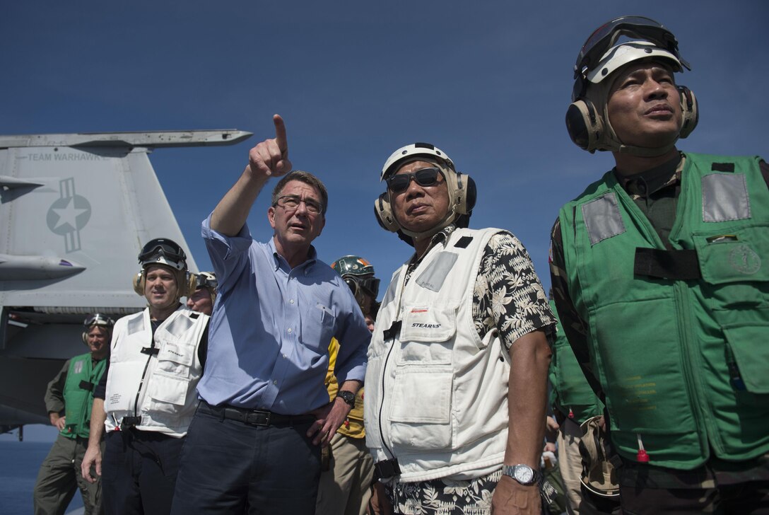 Defense Secretary Ash Carter and Philippine Defense Secretary Voltaire Gazmin tour the flight deck of the USS John C. Stennis in the South China Sea, April 15, 2016. DoD photo by Air Force Senior Master Sgt. Adrian Cadiz