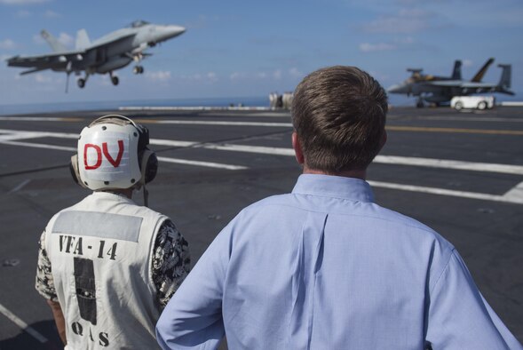 Defense Secretary Ash Carter and Philippine Defense Secretary Voltaire Gazmin watch as an aircraft conducts an arrested landing aboard the aircraft carrier USS John C. Stennis in the South China Sea, April 15, 2016. DoD photo by Air Force Senior Master Sgt. Adrian Cadiz