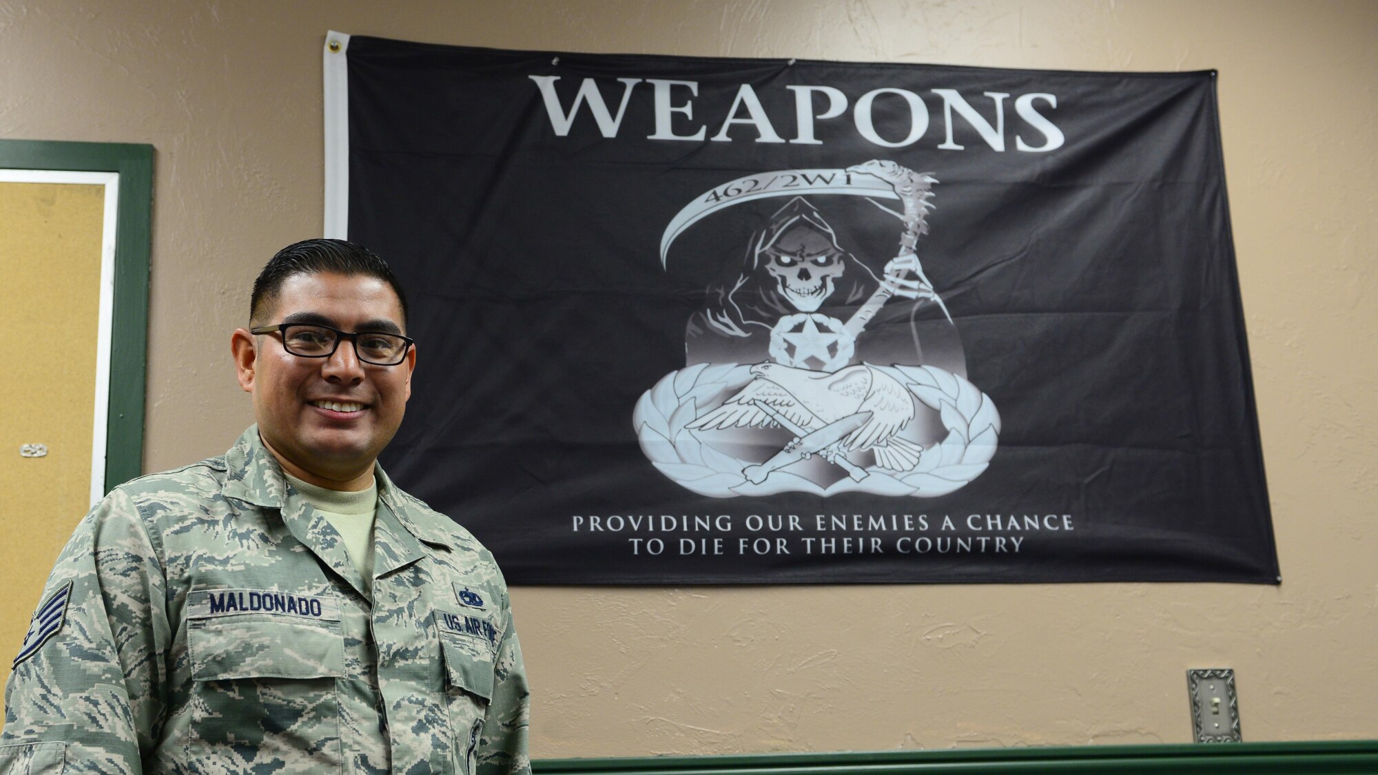 U.S. Air Force Staff Sgt. Jacob Maldonado, a 354th Aircraft Maintenance Squadron weapons expediter, takes a break for a photo April 13, 2016, at Eielson Air Force Base, Alaska. Maldonado said his wife and kids inspire him most because he gets to go home and see their smiling faces every day. (U.S Air Force photo by Airman 1st Class Cassandra Whitman/Released)