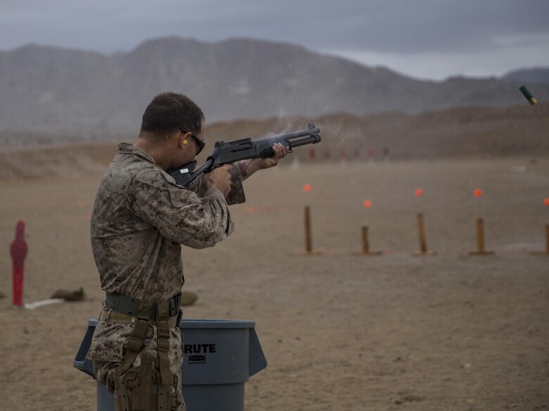 Cpl. James Tipton, Edson Range marksmanship coach, Marine Corps Recruit Depot San Diego, fires a Benelli M1014 shotgun at the Western Regional Combat Match April 8, 2016. Tipton and his team from MCRD San Diego took gold in the team competition. (Official Marine Corps photo by Cpl. Connor Hancock/Released)