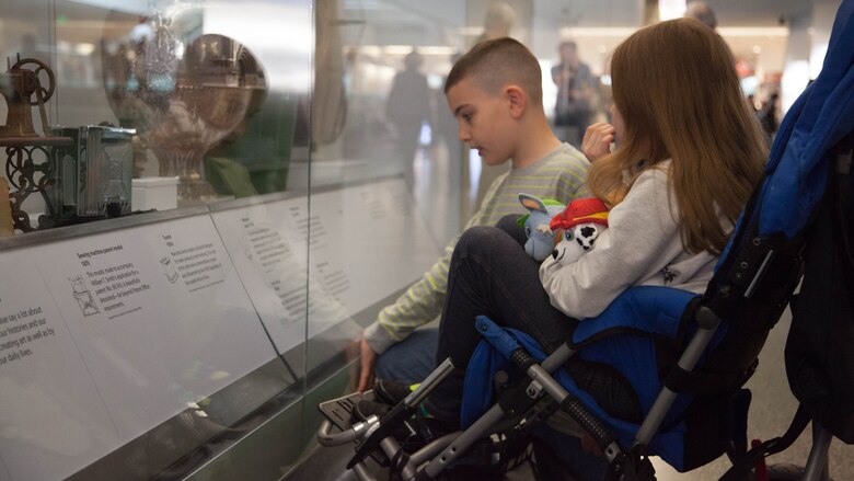 Christian Fagala, 9, reads an excerpt from a display with Lorelei McIntyre-Brewer, 10, at the National Museum of American History April 13. According to the Operation Homefront website, the award recognizes military children who have demonstrated themselves as exceptional citizens while facing the challenges of military family life. Christian is the Marine Corps recipient of the award and Lorelei is the Army recipient. 
