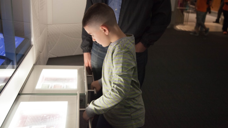 Christian Fagala, 9, looks at a U.S. mint and treasury display at the National Museum of American History April 13. According to the Operation Homefront website, the award recognizes military children who have demonstrated themselves as exceptional citizens while facing the challenges of military family life. Christian is the Marine Corps recipient of the award. 