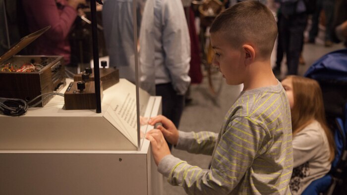 Christian Fagala, 9, reads an excerpt from Ralph Baer’s display at the National Museum of American History April 13. According to the Operation Homefront website, the award recognizes military children who have demonstrated themselves as exceptional citizens while facing the challenges of military family life. Christian is the Marine Corps recipient of the award. 