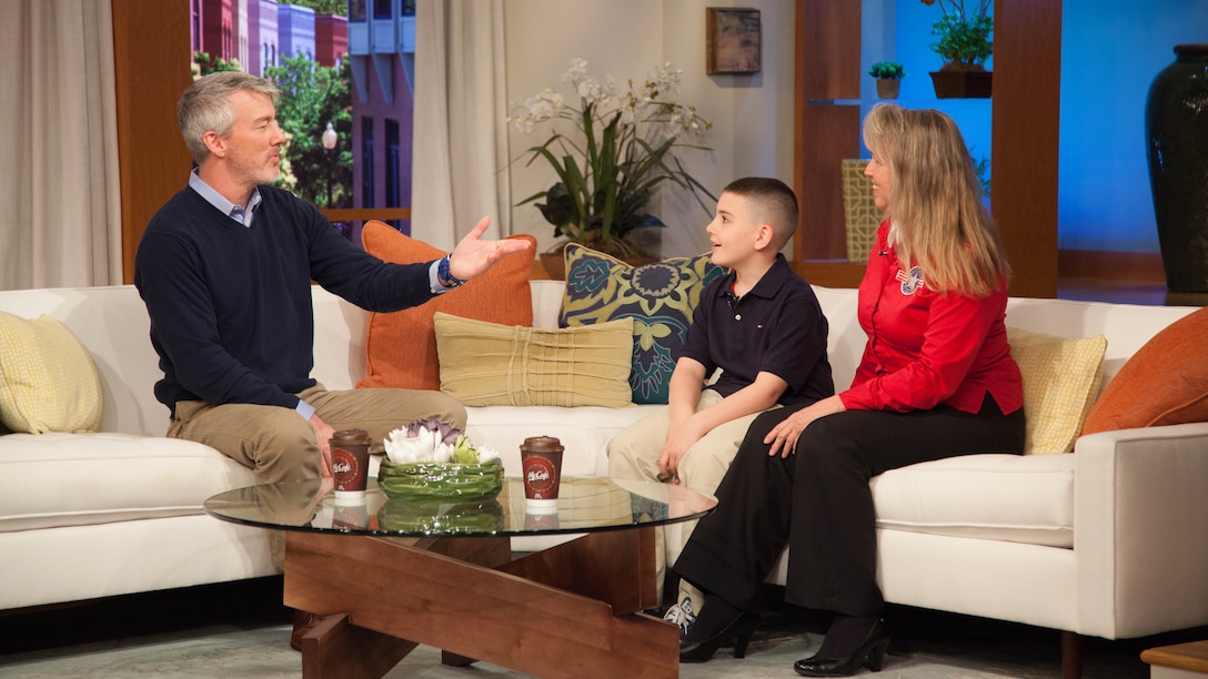 Chris Leary, left, talks to Christian Fagala, right, during a “Great Day Washington” broadcast April 14, at the WUSA9 broadcast station. According to the Operation Homefront website, the award recognizes military children who have demonstrated themselves as exceptional citizens while facing the challenges of military family life. Christian, 9, is the Marine Corps recipient of the award. 