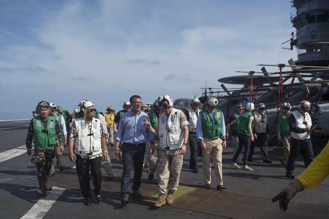 Defense Secretary Ash Carter and Philippine Defense Secretary Voltaire Gazmin, second from left, tour the aircraft carrier USS John C. Stennis as it sails the South China Sea, April 15, 2016. Carter was visiting the Philippines to highlight the importance of the rebalance to the Asia-Pacific region. DoD photo by Air Force Senior Master Sgt. Adrian Cadiz