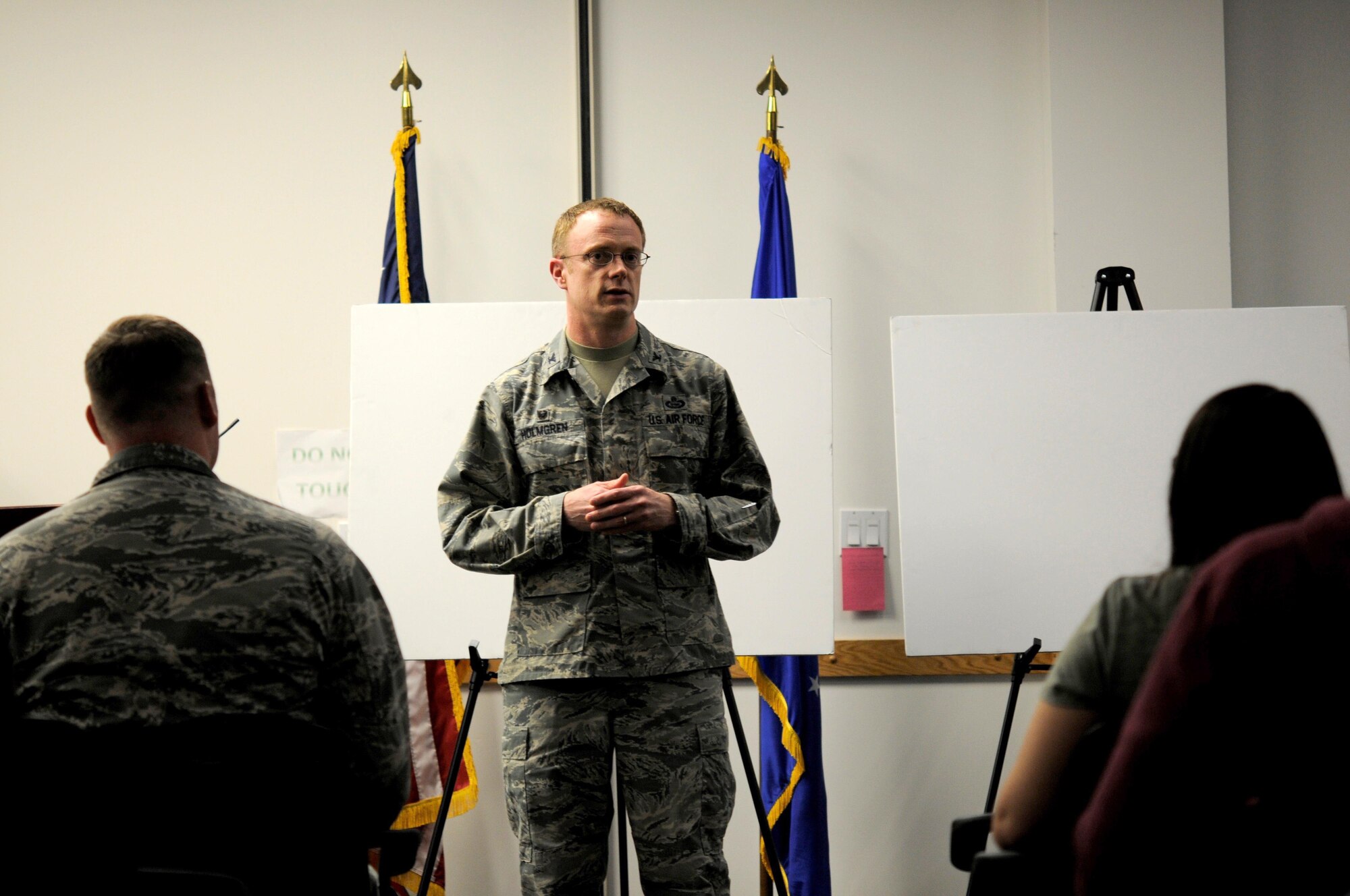 Col. Jacob J. Holmgren, the 548th Intelligence, Surveillance and Reconnaissance Group commander, briefs Airmen and their families about the day-to-day operations of the Distributed Ground Station-2 at an open house hosted by the 548th ISR Group at Beale Air Force Base, on April 13, 2016. The 548th ISR Group opened their doors, allowing family members to get an inside look at the work their Airmen do on a daily basis. (U.S. Air Force photo by Airman 1st Class Taylor A. Workman)