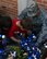 Chief Master Sgt. Eric Hall, 47th Medical Group superintendent, helps children place pinwheels outside of the Child Development Center on Laughlin Air Force Base, Texas, recently. Pinwheels are used to symbolize childlike notions, and to represent the happy and healthy lives children deserve. (U.S. Air Force photo by Senior Airman Jimmie D. Pike)