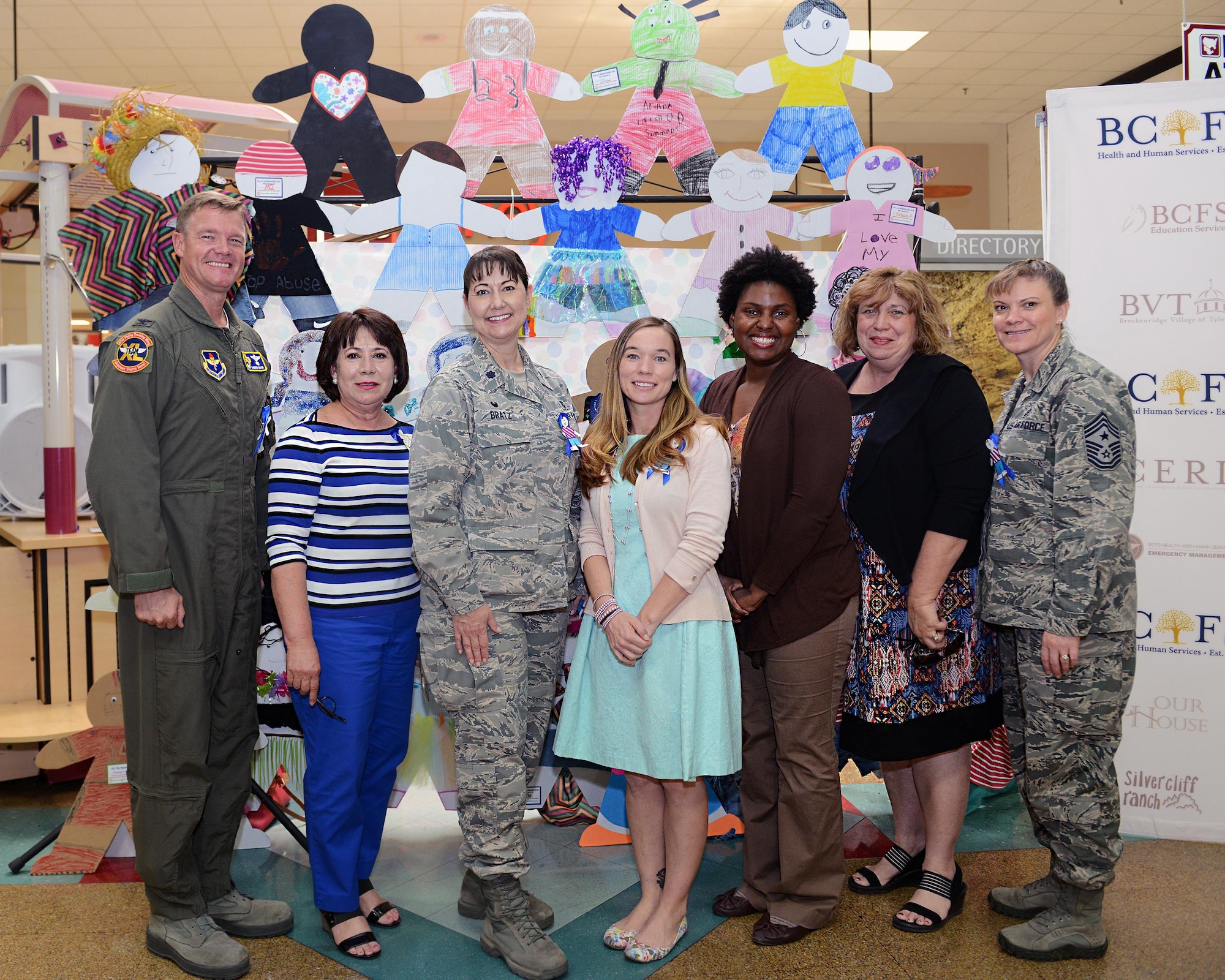 From left to right, Col. Thomas Shank, 47th Flying Training Wing commander, Silvia Gonzalex, 47th Medical Operation Squadron family advocacy administrative assistant, Lt. Col. Bratz, 47th MDOS commander, Casey Molleson, 47th MDOS family advocacy outreach manager, Aliyah Negley, 47th FTW community support coordinator, Judy Rhinesmith, 47th MDOS new parent support program manager, and Chief Master Sgt. Teresa Clapper, 47th FTW command chief, pose for a picture at the Plaza Del Sol Mall in Del Rio, Texas, recently. Laughlin members attended the event to show support for Child Abuse Prevention. (U.S. Air Force photo by Senior Airman Jimmie D. Pike)