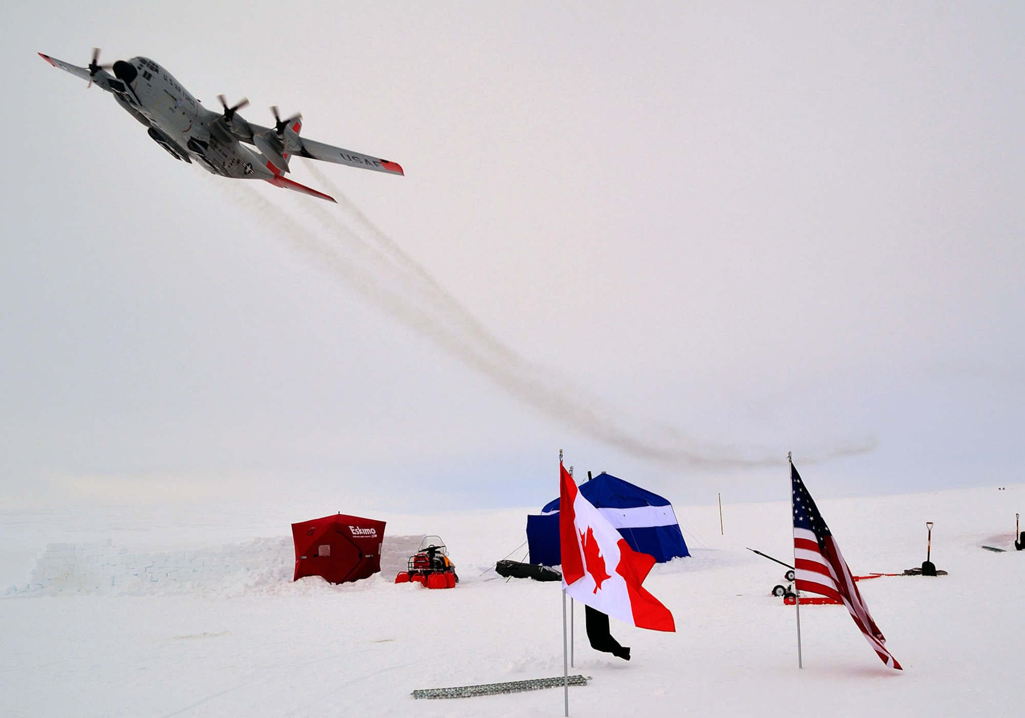 An LC-130 belonging to the New York Air National Guard's 109th Airlift Wing flies over Ice Camp one on Sherard Osborne Island, Nunavut, during 2014 Operation Nunalivut training on April 15. The New York Air National Guard flies the only ski-equipped C-130 aircraft in the world and has supported the annual Canadian Forces exercise in 2014, 2015 and again in 2016. (U.S. photo by Tech. Sgt. Catharine Schmidt) 
