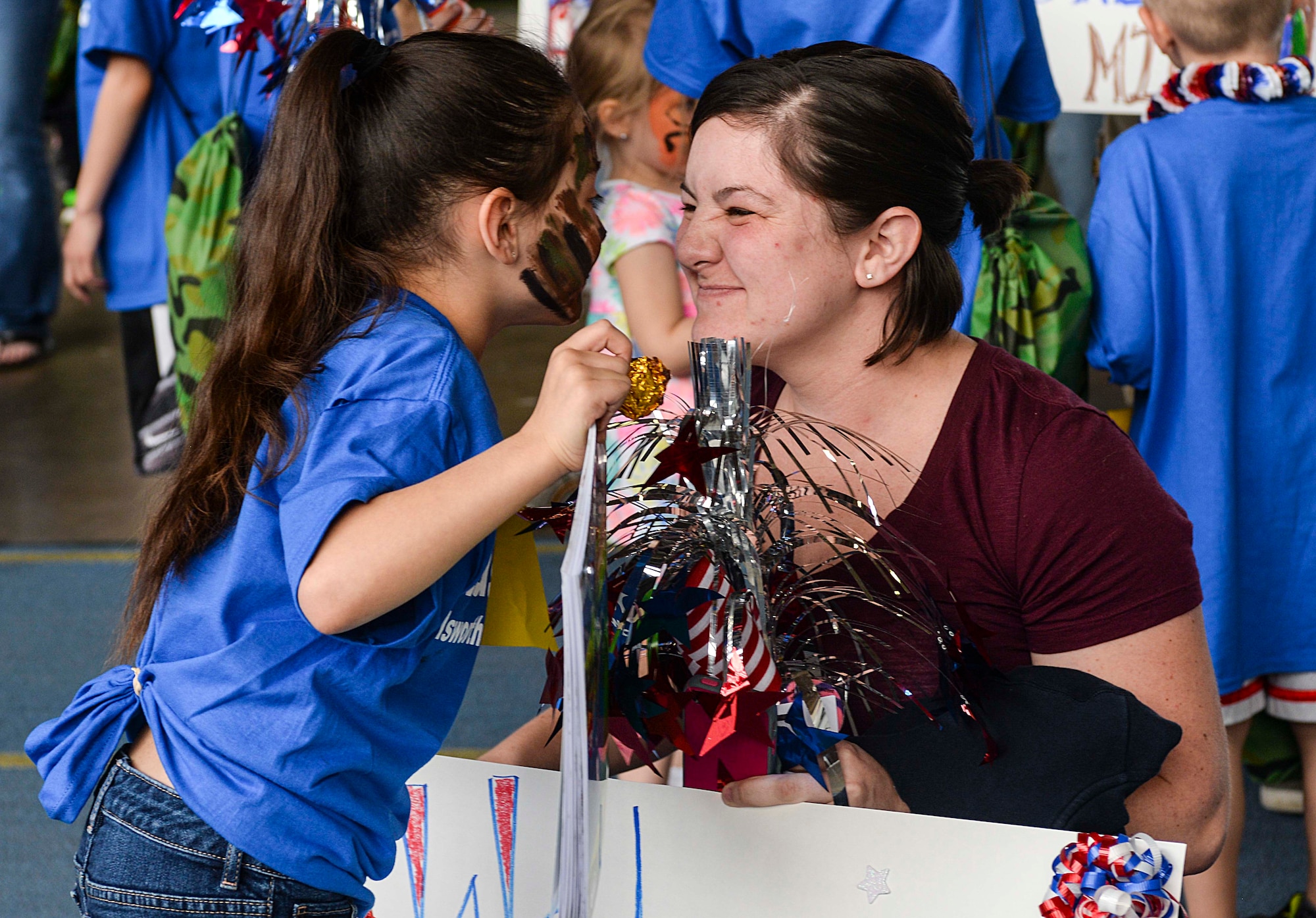 Natalie Mitchell, daughter of Tech. Sgt. Amanda Mitchell, 28th Medical Operations Squadron family health clinic NCO in charge, greets her mom after returning from a simulated deployment at Ellsworth Air Force Base, S.D., April 9, 2016. In 1986, the Department of Defense designated April as the Month of the Military Child in an effort to recognize and give thanks to the courage and support of these children. (U.S. Air Force photo by Airman 1st Class Sadie Colbert/Released)