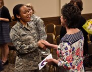 Airman 1st Class Cua Beckers, 92nd Air Refueling Wing military justice paralegal, shakes the hand of Shelly Monahan-Cain, a sexual assault survivor, after a speaking event April 14, 2016, at Fairchild Air Force Base, Wash. Monahan-Cain is a sexual assault survivor and was one of 40 victims of a high profile criminal in the late 1970s and early 1980s named the South Hill Rapist. She has given more than 4,500 sexual assault and rape recovery talks across the country to women’s and men’s groups, high schools, middle schools and church groups. (U.S. Air Force Photo/Airman 1st Class Taylor Bourgeous)
