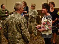 Chief Master Sgt. Christian Pugh, 92nd Air Refueling Wing command chief, speaks with Shelly Monahan-Cain, a sexual assault survivor, after a speaking event April 14, 2016, at Fairchild Air Force Base, Wash. Monahan-Cain is a sexual assault survivor who was one of 40 victims of a high profile criminal in the late 1970s and early 1980s named the South Hill Rapist. The Sexual Assault Prevention and Response office hosted Monahan-Cain as she shared her personal rape story and stressed the importance of sexual assault prevention. (U.S. Air Force Photo/Airman 1st Class Taylor Bourgeous)