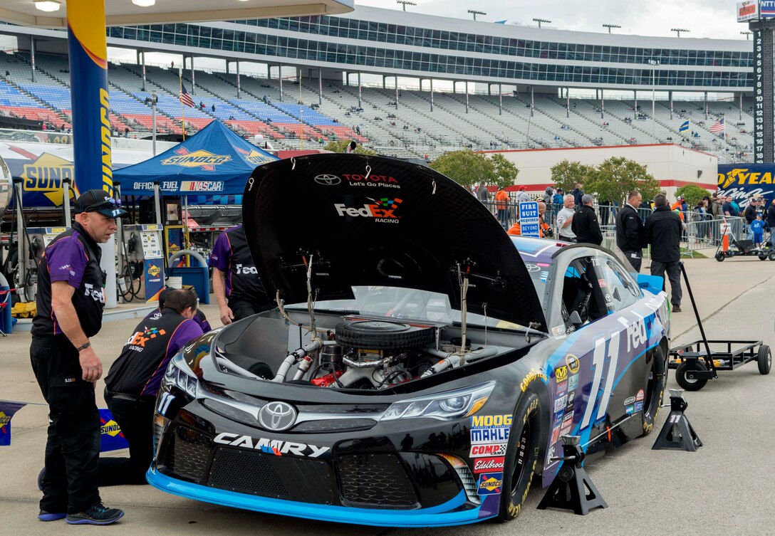 The number 11 car, driven by Denny Hamlin, is given a pre-race inspection April 9, 2016, at the Texas Motor Speedway, Fort Worth, Texas. U.S. Air Force Gen. David L. Goldfein, United States Air Force vice chief of staff attended the race to administer the oath of enlistment to a group of fourteen men and women in the Air Force Delayed Entry Program. (U.S. Air Force photo by Airman 1st Class Austin Mayfield/Released)