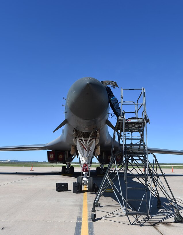 U.S. Air Force Senior Airman Aldo Delacruz, 28th Aircraft Maintenance Unit, conducts maintenance on the nose section of a B-1B Lancer April 5, 2016, at Dyess Air Force Base, Texas. Delacruz, an electrical environmental components specialist, was conducting routine wire maintenance inside the B-1. The B-1 features advanced navigational radar in the nose of the aircraft that allows it to safely follow terrain at low altitude levels. (U.S. Air Force photo by Senior Airman Alexander Guerrero/Released)