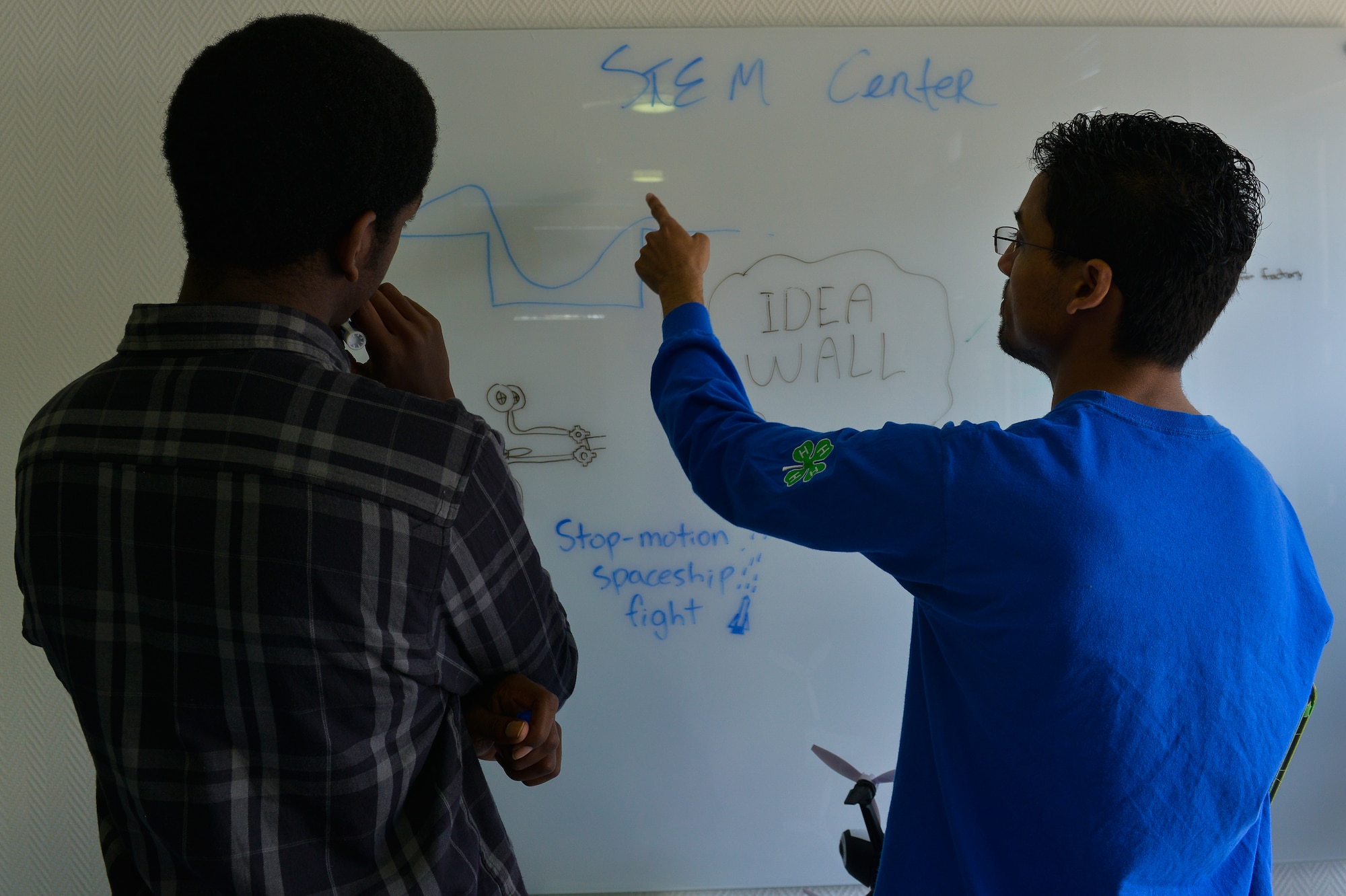 William Nettles, high school student, and Vikramieet Rathaur, 86th Force Support Squadron recreations assistant, brainstorm as they put the new Science, Technology, Engineering, Mathematics Center of Innovation together April 14, 2016, at Ramstein Air Base, Germany. The center is designed for Kaiserslautern Military Community school students as a multipurpose center for doing homework, recording video and sound in its studio and more. (U.S. Air force photo/Airman 1st Class Lane T. Plummer)