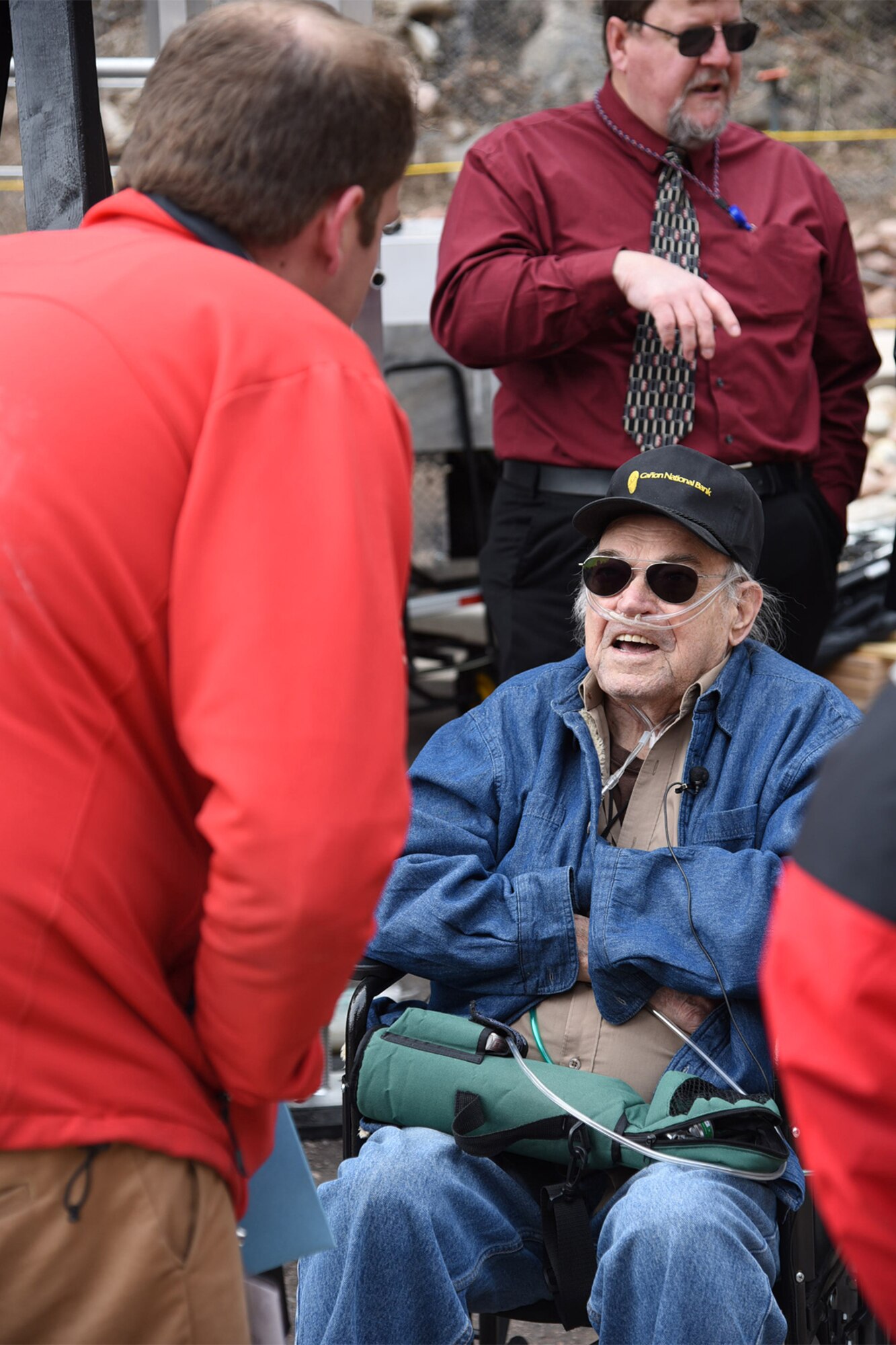 CHEYENNE MOUNTAIN AIR FORCE STATION, Colo. - Retired Staff Sgt. Bill Bunker, 61st Air Force Police Squadron, is interviewed by regional media outlets following the 50th Anniversary Rededication Ceremony at Cheyenne Mountain Air Force Station April 15, 2016. Bunker was previously stationed at the mountain. With the nickname America's Fortress, CMAFS is situated beneath 2,000 feet of granite and consists of 15 buildings resting on more than 1,300 enormous steel springs. Cheyenne Mountain AFS is owned by the 21st Space Wing at Peterson Air Force Base, and operated by the 721st Mission Support Group. (U.S. Air Force photo by Robb Lingley)