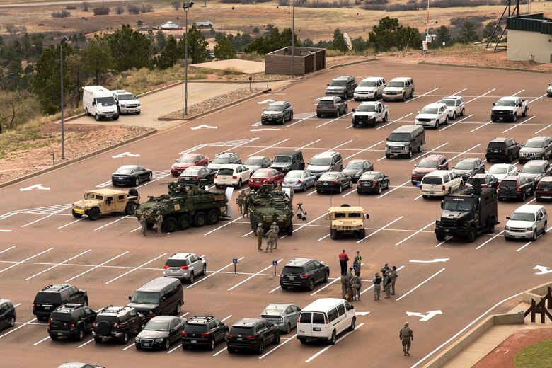 CHEYENNE MOUNTAIN AIR FORCE STATION, Colo. – Military and El Paso County Sheriff vehicles provide support during the 50th Anniversary Rededication Ceremony to Cheyenne Mountain Air Force Station April 15, 2016. Since its inception during the Cold War through the war on terrorism, Cheyenne Mountain has remained critical to the defense mission providing command and control for the nation since 1966. Cheyenne Mountain AFS is owned by the 21st Space Wing at Peterson Air Force Base, and operated by the 721st Mission Support Group. (U.S. Air Force photo by Staff Sgt. Tiffany DeNault)