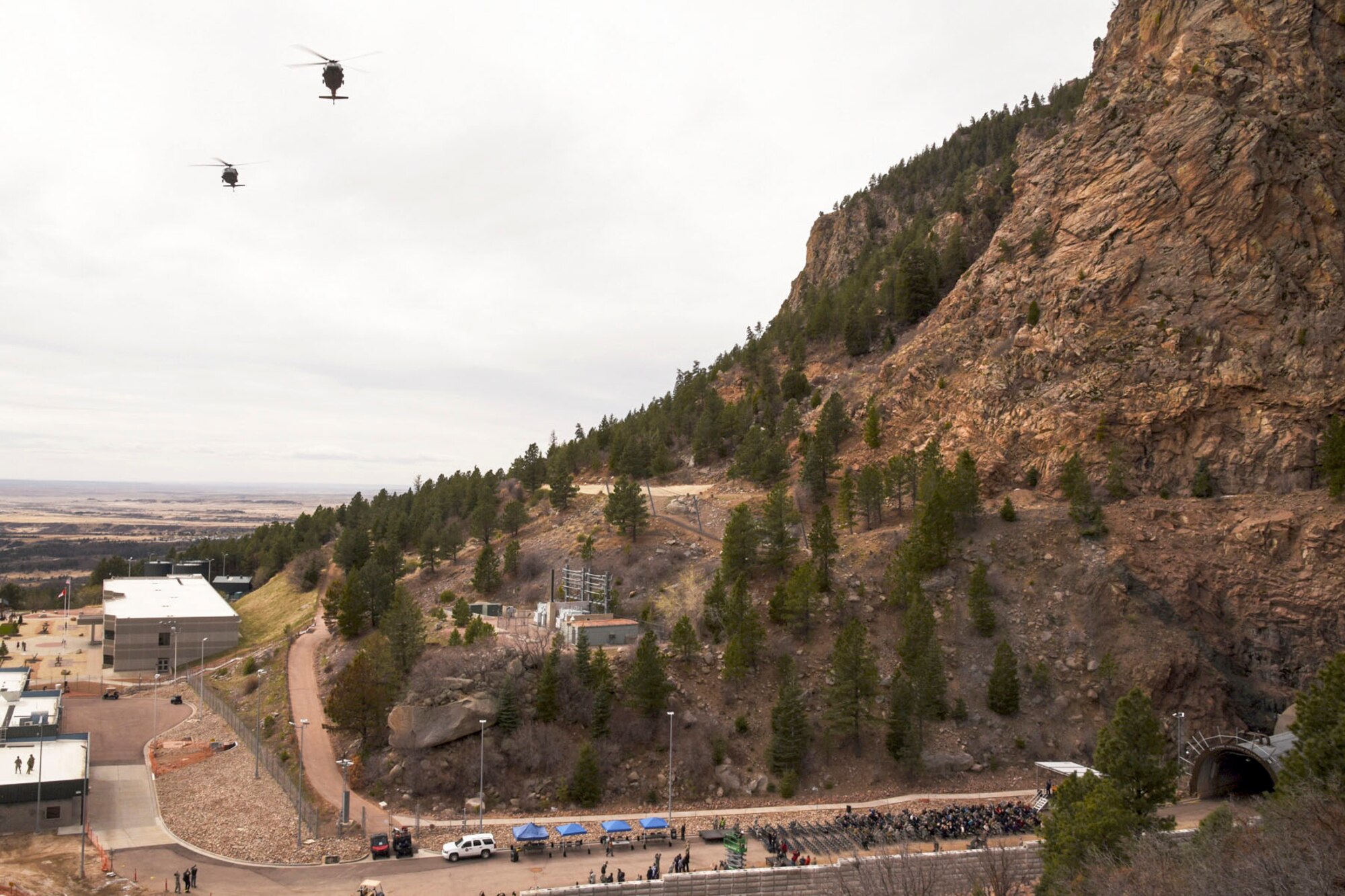 CHEYENNE MOUNTAIN AIR FORCE STATION, Colo. – Two UH-60 Black Hawks, 4th Combat Aviation Brigade, 4th Infantry Division, flyover as part of the 50th Anniversary Rededication Ceremony at Cheyenne Mountain Air Force Station April 15, 2016. Since its inception during the Cold War through the war on terrorism, Cheyenne Mountain has remained critical to the defense mission providing command and control for the nation since 1966. Cheyenne Mountain AFS is owned by the 21st Space Wing at Peterson Air Force Base, and operated by the 721st Mission Support Group. (U.S. Air Force photo by Staff Sgt. Tiffany DeNault)